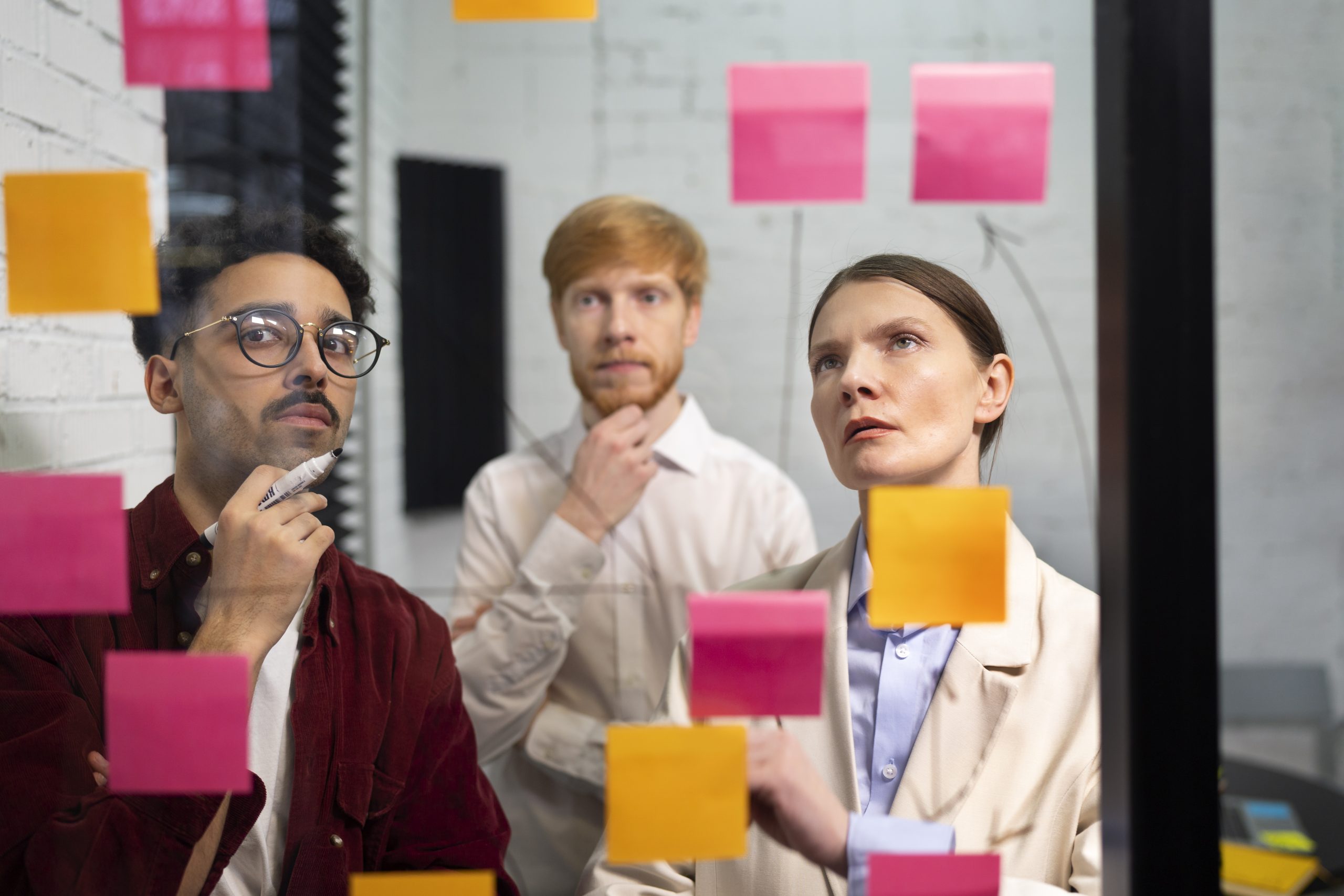 A diverse group of people participating in a focus group discussion in a professional setting.