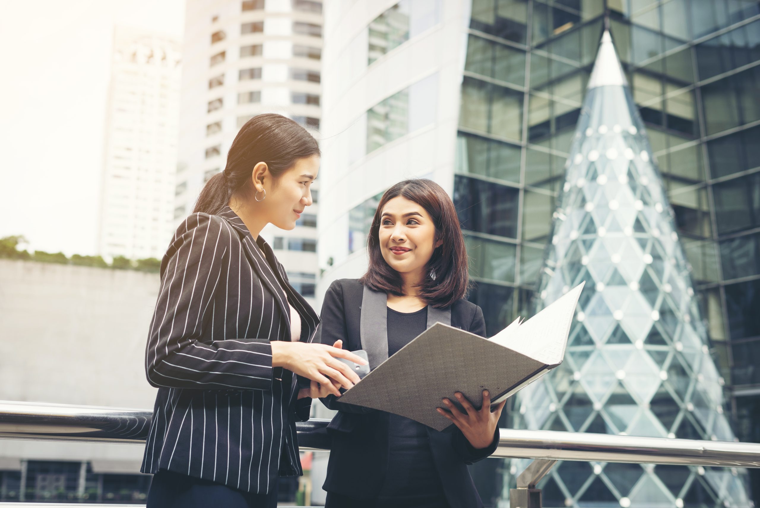 A magnifying glass focusing on a business chart, symbolizing the in-depth process of competitor analysis.