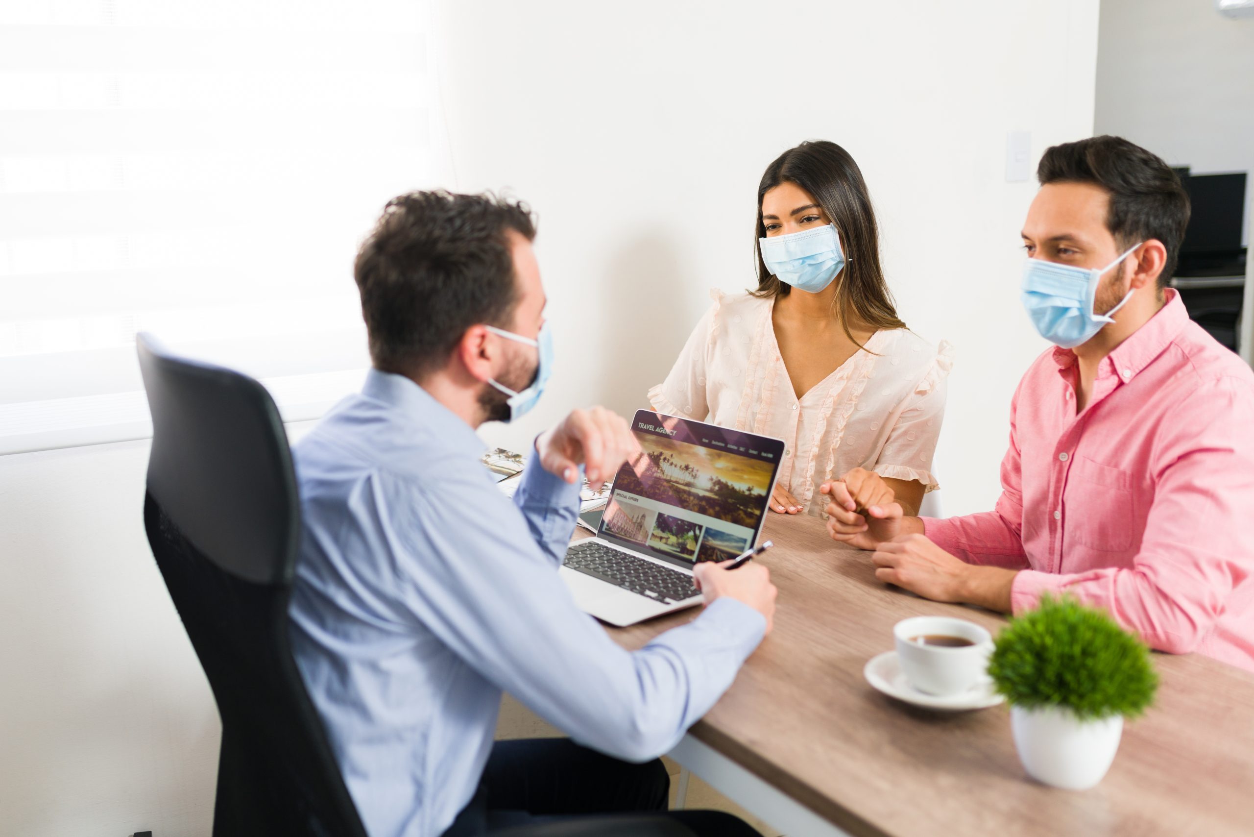 A happy Indian family being protected by a conceptual health insurance shield, representing safety and security.