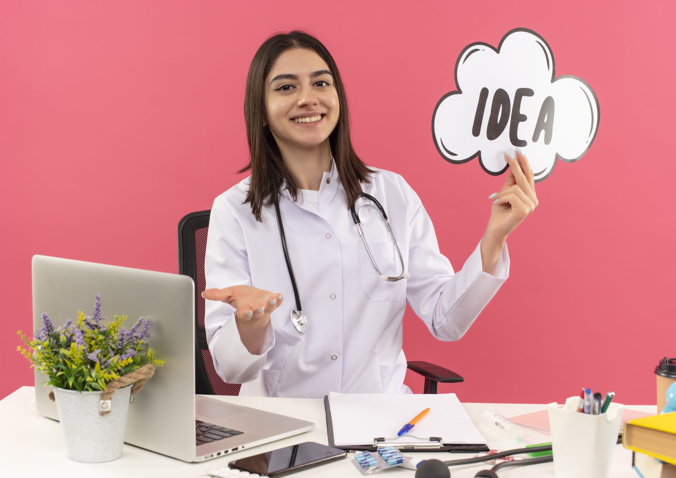 A happy Indian family being protected by a conceptual health insurance shield, representing safety and security.